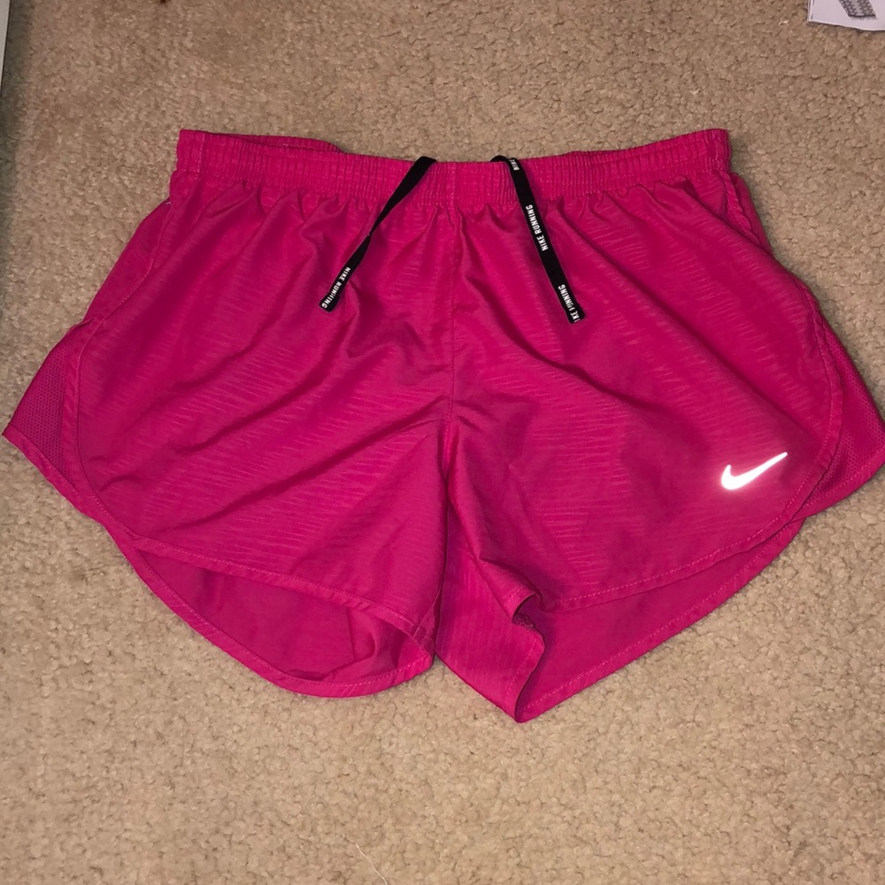 Pink Nike running shorts